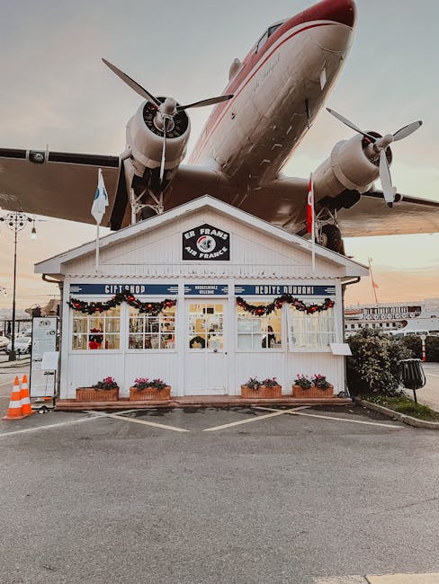 Iconic boutique gift shop beneath a vintage aircraft