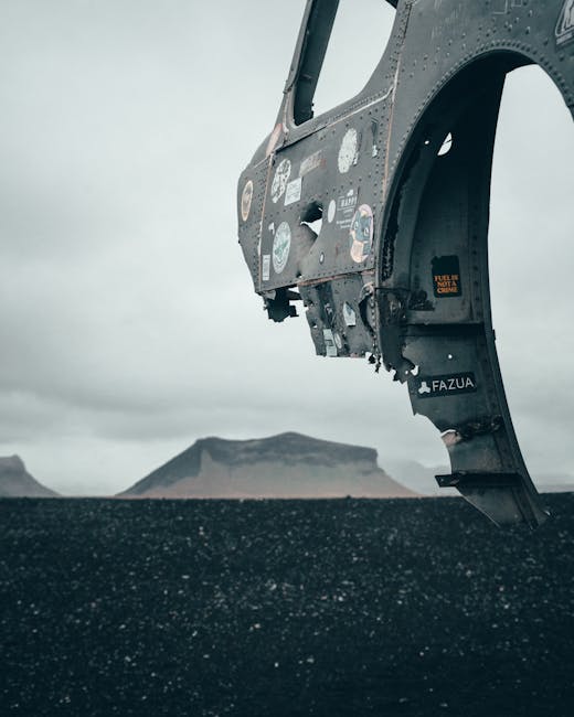 Aircraft wreckage on a remote black sand beach
