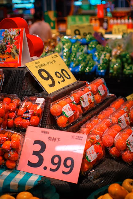Fresh persimmons at a local market with price tags